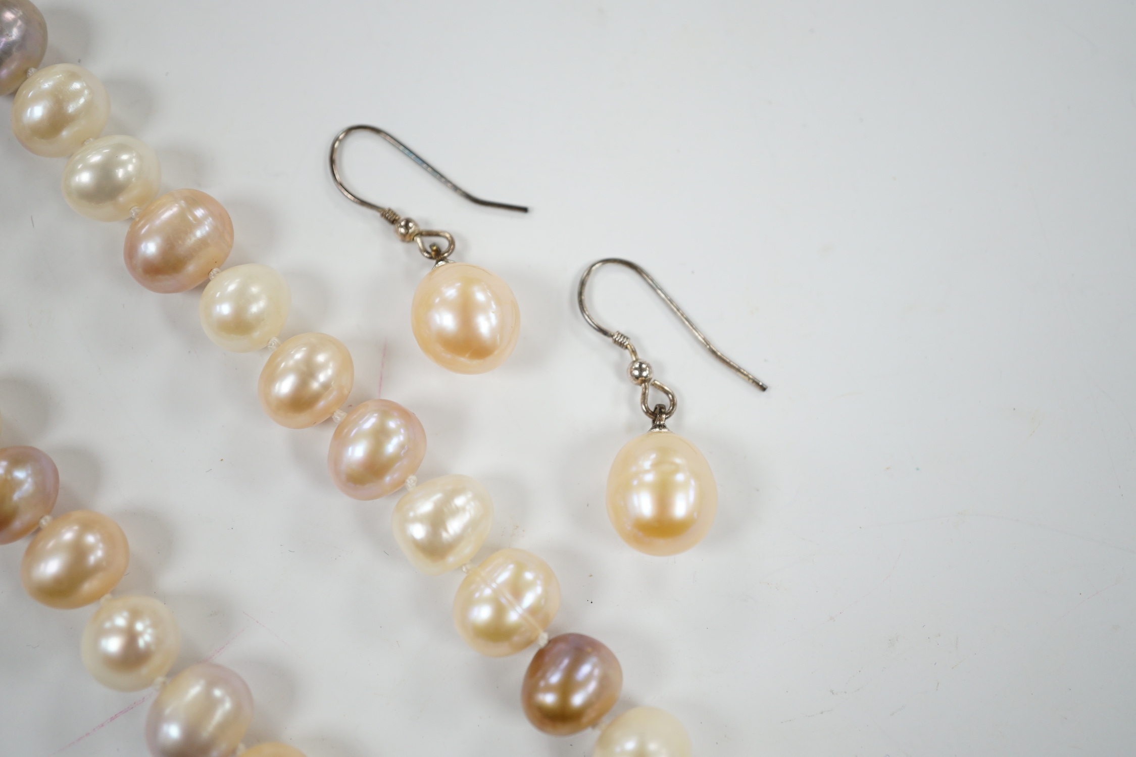 A single strand multi coloured freshwater pearl necklace, 44cm and a pair of freshwater pearl drop earrings.